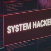 computer-monitor-showing-hacked-system-alert-message-flashing-screen-dealing-with-hacking-cyber-crime-attack-display-with-security-breach-warning-malware-threat-close-up